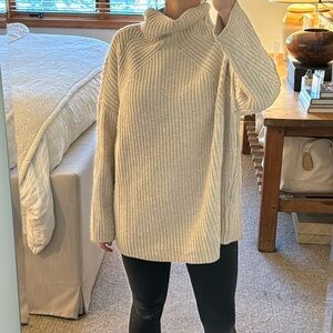 Naadam. small oversized turtleneck sweater. cream.